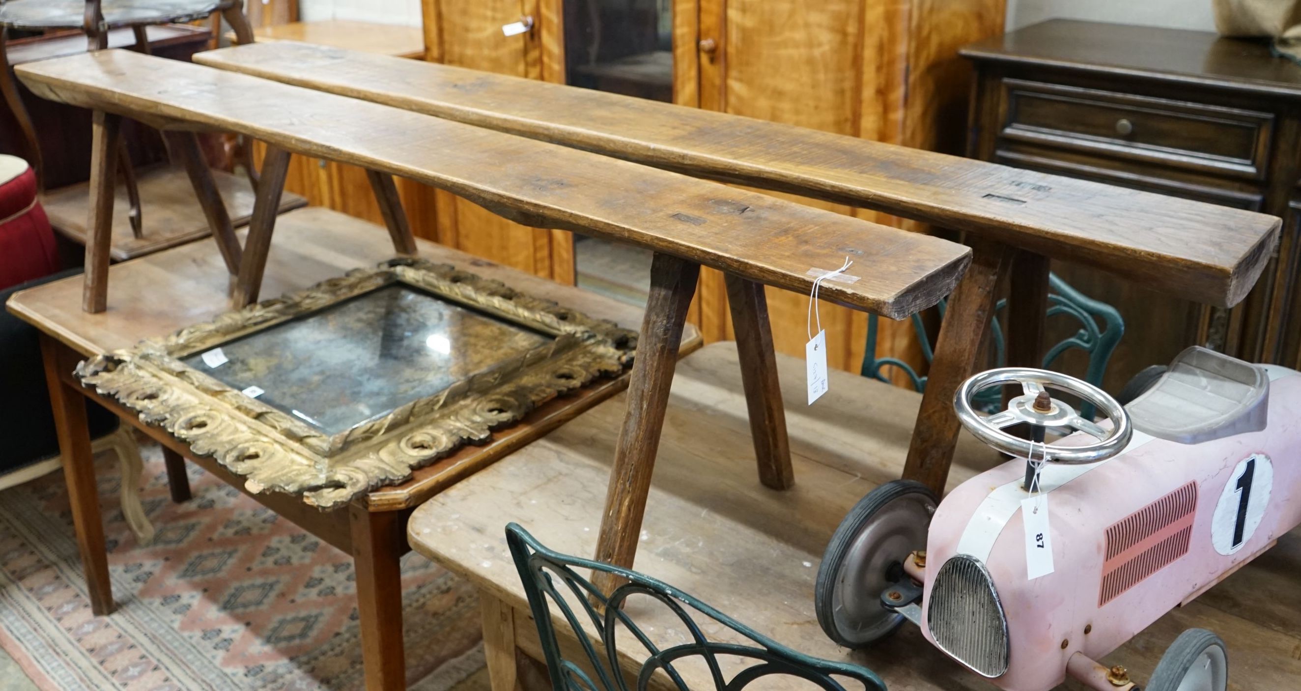 A pair of French provinical oak benches, length 194cm, height 45cm, width 21.5cm